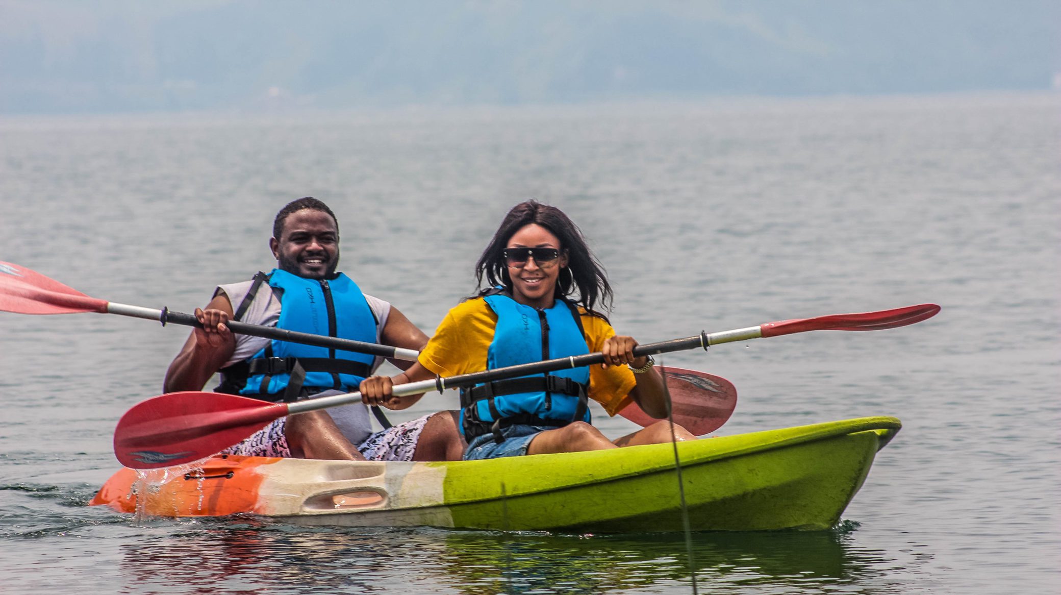 Guests kayaking on Lake Kivu at Tchegera Island
