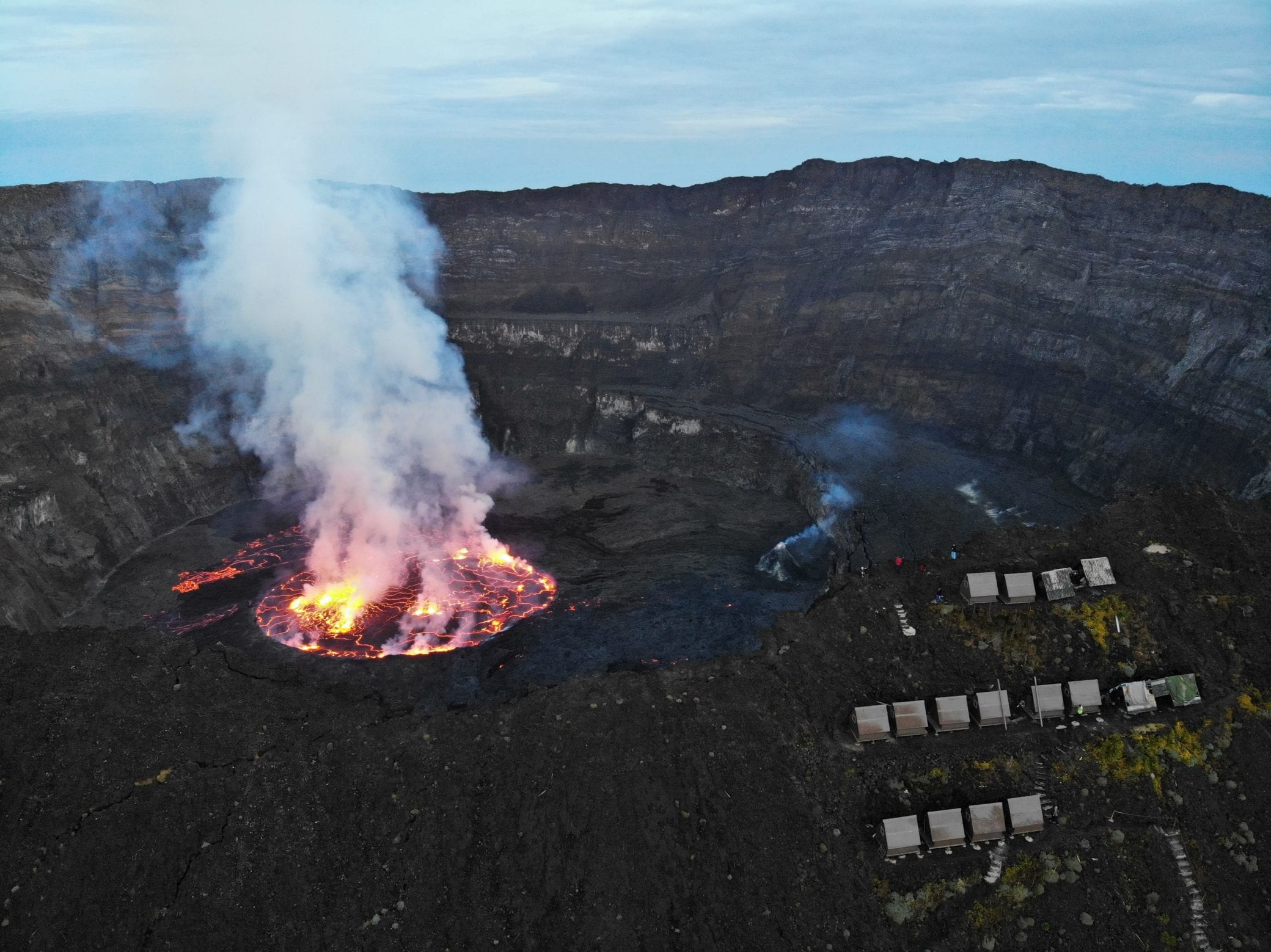 My Nyiragongo crater and lava lake showing the huts